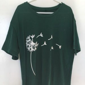 Green tee shirt with dandelion